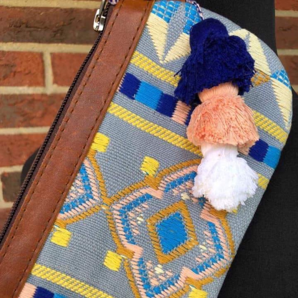 Nena Falseria clutch with POMs